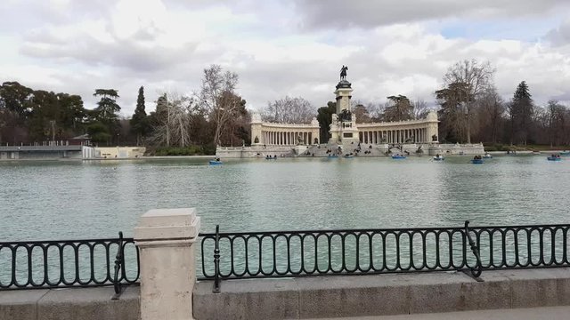 Wonderful lake with paddle boats at Retiro Park in Madrid