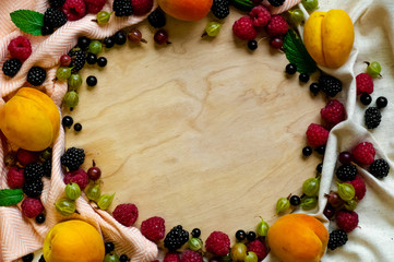 fresh organic Fruits on Wooden Background. Healthy Vegetarian food, View from above. Place for text. Copy Space. Summer