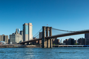 New York City / USA - JUN 25 2018: Brooklyn Bridge Park with Lower Manhattan skyline at early...