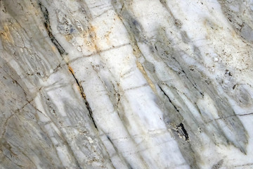 Multicolored layered marble texture with different veins, may be used as background