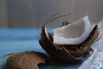 chopped coconut on a blue wooden background