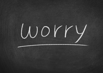 Obraz premium worry concept word on a blackboard background