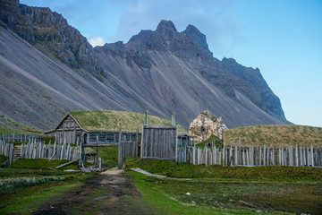 Old village with green roofs and wood buildings