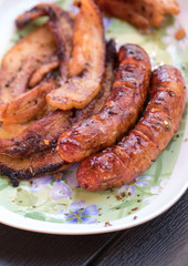 Unhealthy but tasty grilled sausages and meat