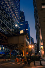 Chicago Loop downtown city street night scenery with the Sears Willies tower and CTA elevated train tracks