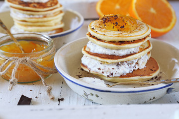 Ricotta pancakes with orange jam and chocolate, two portions