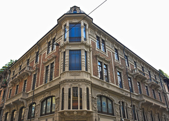 Fototapeta na wymiar Liberty style old building in Turin, Italy, angle view