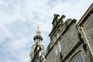 Tower of the former cityhall surrounde by crow-step gables