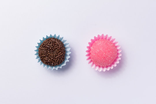 Brazilian sweets: Brigadeiro and Bicho de Pe. Children birthday parties. Flat lay design of candy ball. Macro, close up.