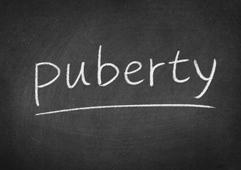 Obraz premium puberty concept word on a blackboard background