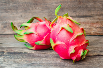 Dragon fruit on wood background.