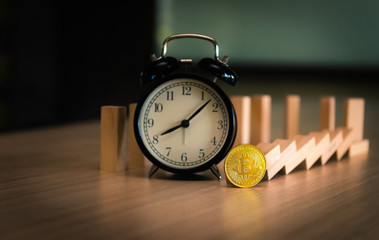 Time for bitcoin with alrm clock, Stock exchange and downtrend concept