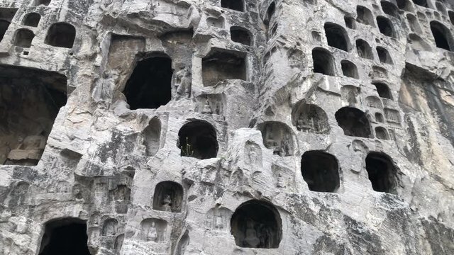 Panning view of the Longmen Grottoes in Luoyang, China