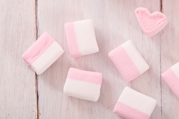 Marshmallows on wooden table. 