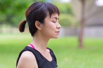 Young woman meditating in nature