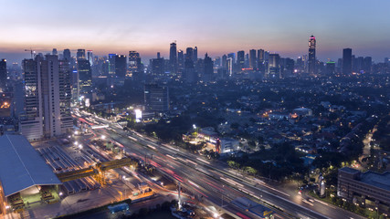 Fototapeta na wymiar Highway and skyscrapers in Jakarta city