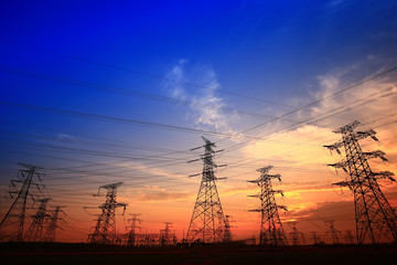 Fototapeta premium Electric tower, silhouette at sunset