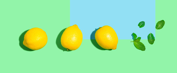 Fresh lemon pattern on a bright color background flat lay