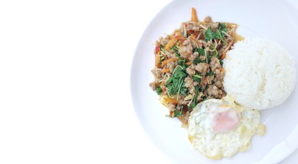 Thai style food of Rice topped with stir-fried minced pork and basil with Fried egg in white dish on white background. In Thai called 
