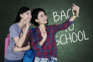 Two female students taking a selfie together