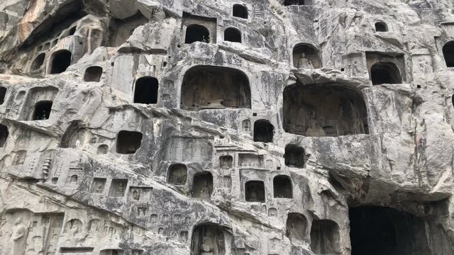 Panning view of the Longmen Grottoes in Luoyang, China
