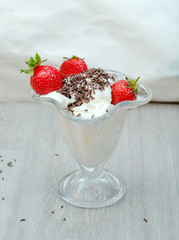 cream with strawberries in the bowl
