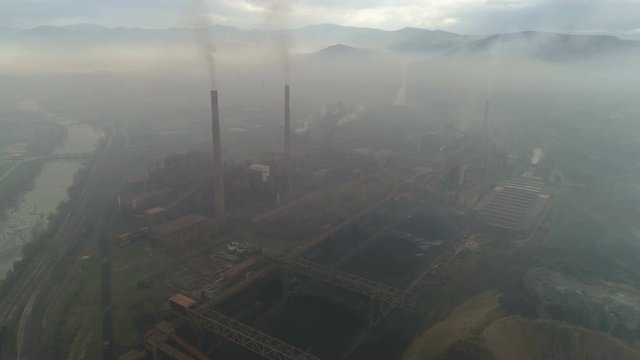 Apocalyptic drone footage of huge steel factory, causing massive air pollution in Zenica city in Bosnia and Herzegovina