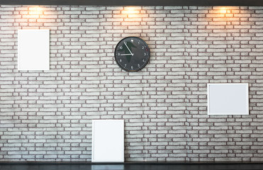 Concrete wall decoration with a picture frame and clock.