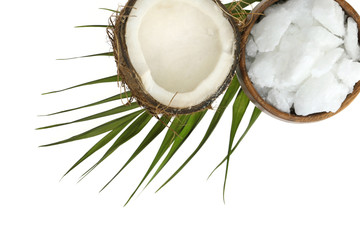 Coconut oil.  organic natural coconut oil  in a wooden round bowl, half fresh coconut and a palm...