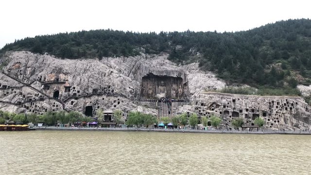 Panning view of the Longmen Grottoes in Luoyang, China