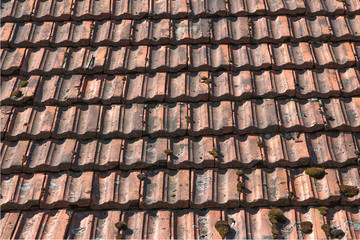 Closeup texture of old red roof tiles.Old roof at village house.