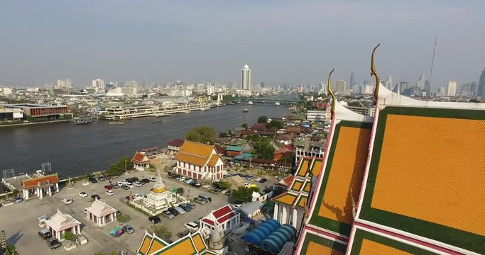 Aerial view of Wat Kalaya and revealing Bangkok Skyline.