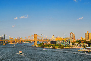 Brooklyn Bridge across the East River between the Lower Manhattan and Brooklyn.