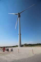 Wind turbine wings in the dunes of Neeltje Jans island in the Netherlands.
