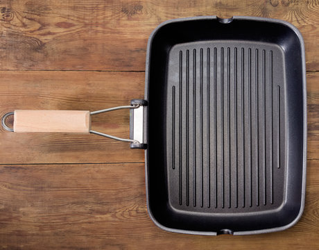 Top view of empty rectangular grill pan on rustic table