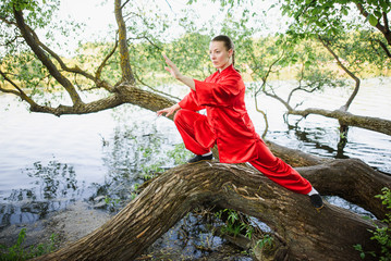 women practicing yoga and tai chi outdoors
