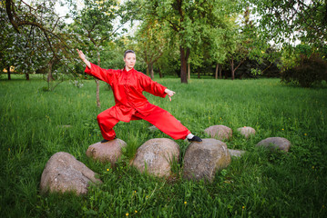 women practicing yoga and tai chi outdoors