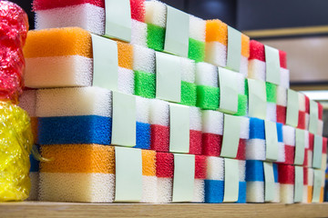 Sponge, a variety of color pack, put together on a wooden rack. Stocks for sale