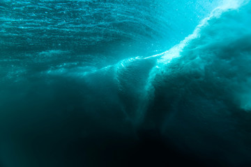 Barrel wave is underwater. Blue ocean in underwater