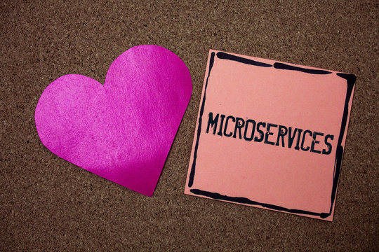 Word writing text Microservices. Business concept for Software development technique Decomposing an application Love heart sticky small papers remember rough dark background line drawing.