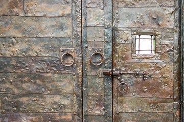 Close-up of metal massive door in an ancient fortress Gonio, Georgia