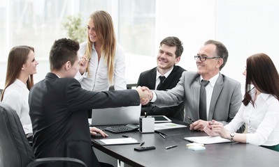 business partners shaking hands after a successful transaction