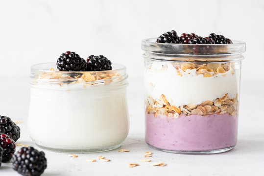 Overnight Oats Or Healthy Breakfast Parfait With Yogurt, Granola And Berries In Jar On White Background. Healthy Eating, Healthy Lifestyle Concept