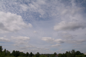 White clouds on the blue sky.

