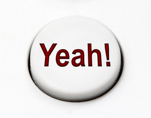 A white round button switch for agree Yeah close up. Control mechanical key for emotion of user on control device.