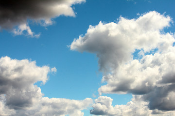 Naklejka na ściany i meble white clouds on background of dark blue sky