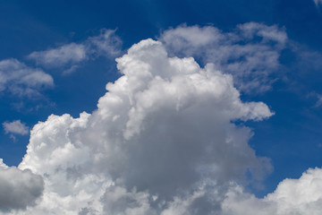 White fluffy clouds in the blue sky background