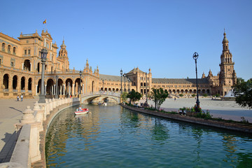 Fototapeta na wymiar Seville, Spain - June 21, 2018: Plaza de España in Seville and its canals.