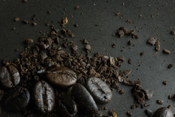 The  coffee roasted on  black texture close up background..