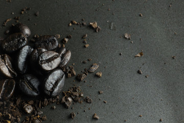 The  coffee roasted on  black texture close up background..